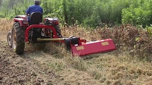 Side reach arm mower