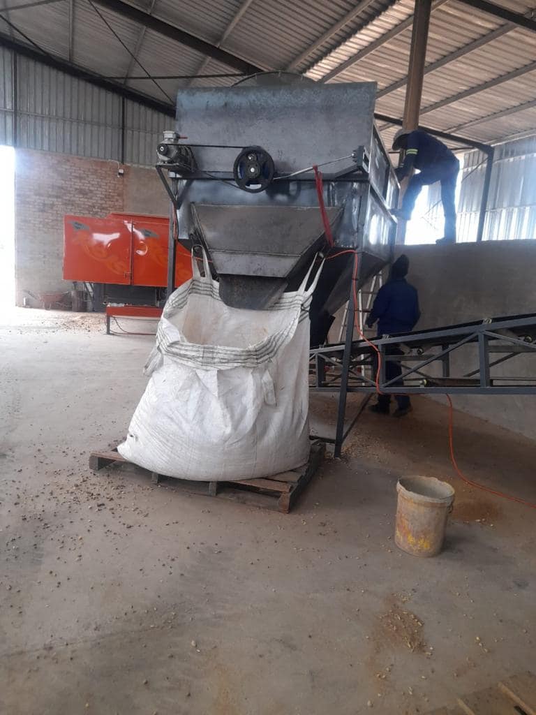 Trommel inside bin with bagging discharge and overs discharge onto belt